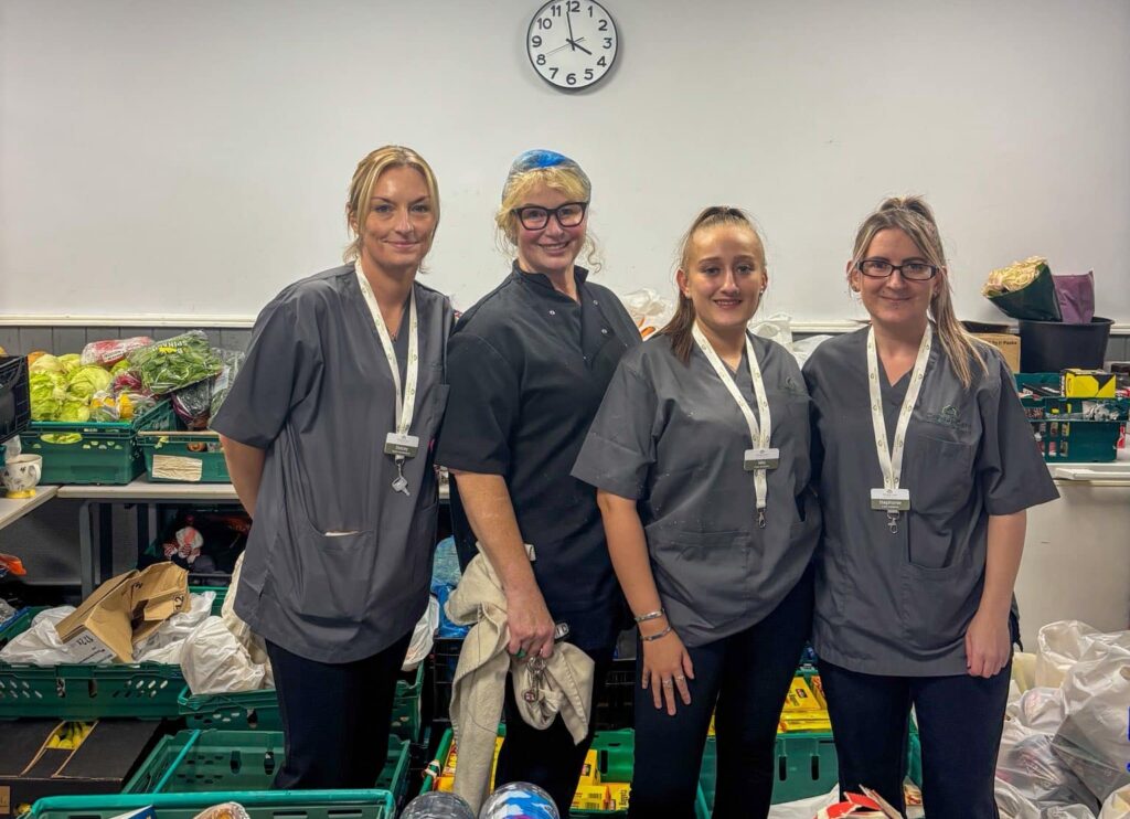 Four female care team members from Fairwood Fields care home in Pontefract standing in a kitchen